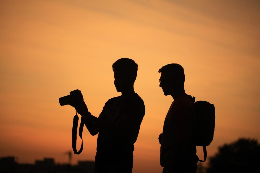 men, silhouettes, camera, photographer, nature, sky, sunset, outdoors, vacation, photography, orange sky, people, taking pictures, tourists, travellers